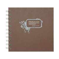 blue silkscreened design on brown board journal cover